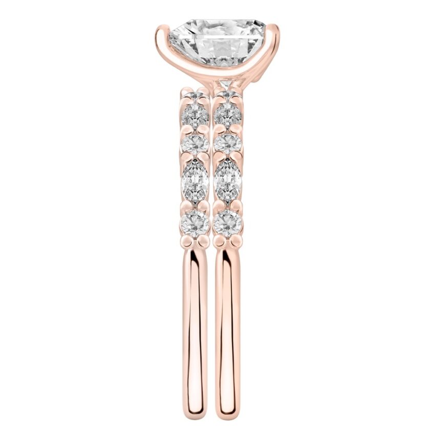 Side view of heart shape diamond marquise and round diamond ring set rose gold