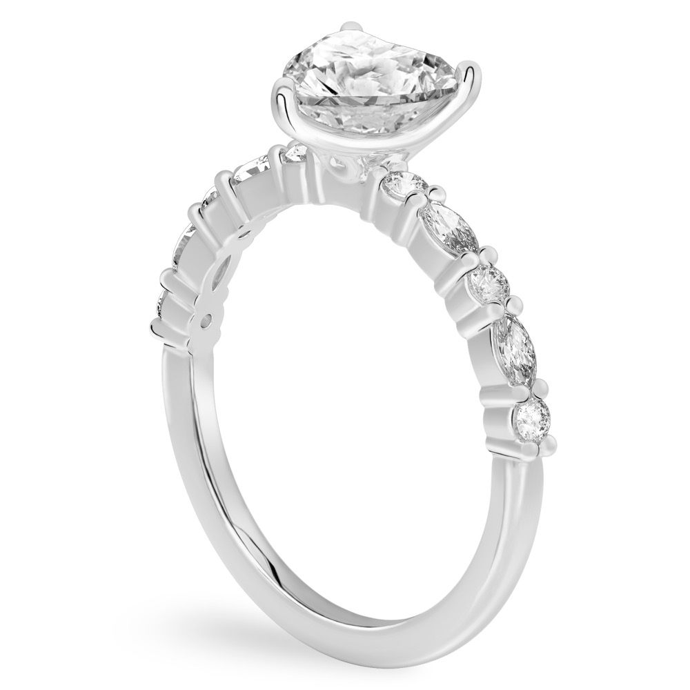 Angle view of heart shape diamond marquise and round diamond ring white gold