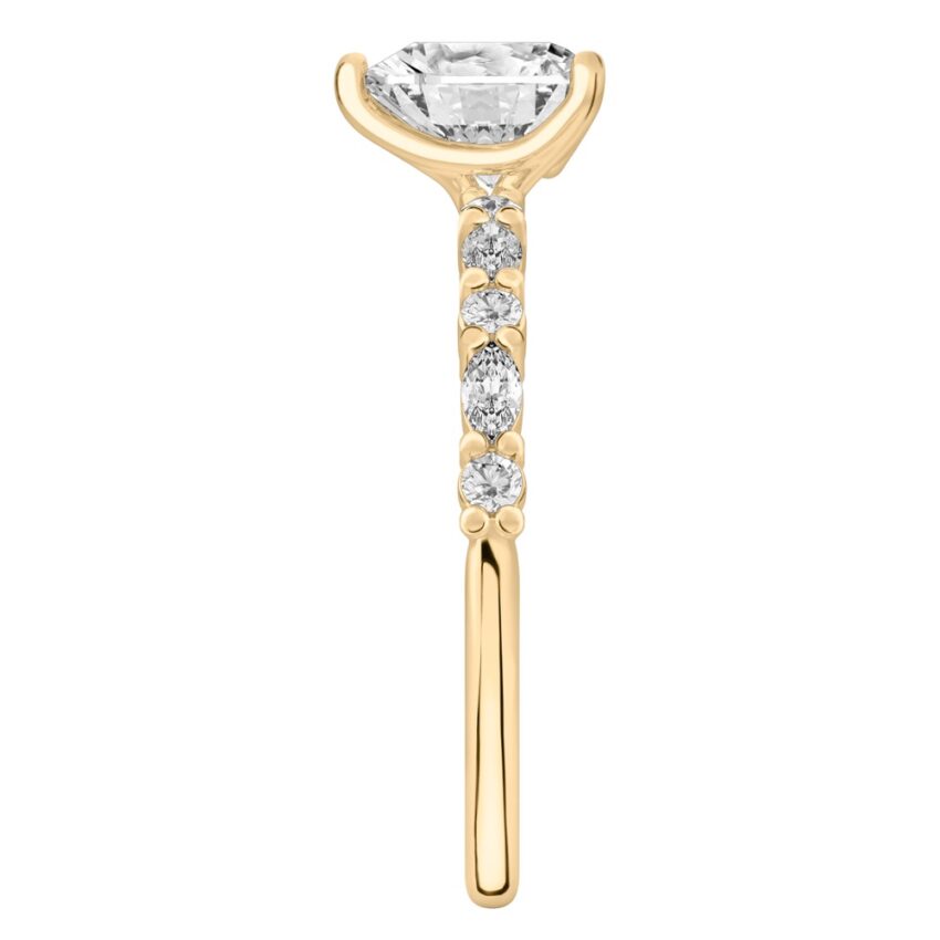 Side view of heart shape diamond marquise and round diamond ring yellow gold