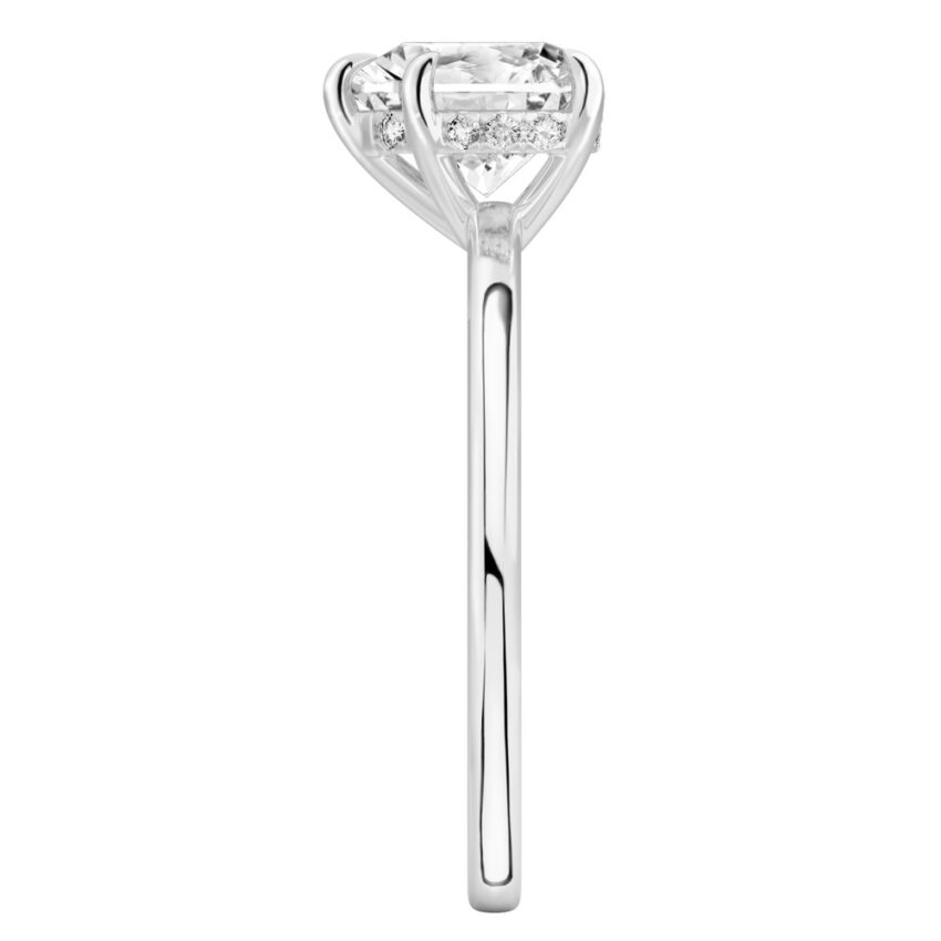 Side view of heart shape diamond ultra low hidden halo engagement ring in platinum