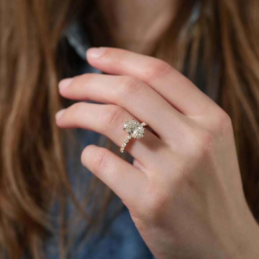 hidden halo marquise and round diamond ring lifestyle