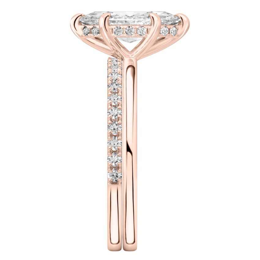 Side view of marquise cut diamond hidden halo engagement ring set rose gold
