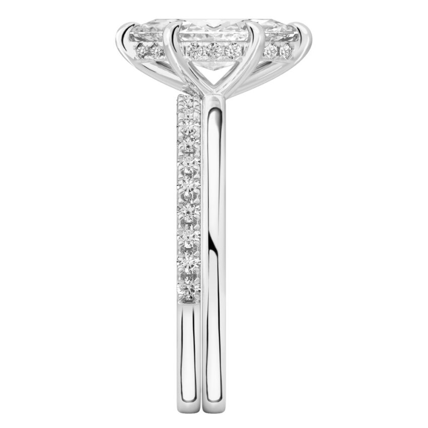 Side view of marquise cut diamond hidden halo engagement ring set white gold