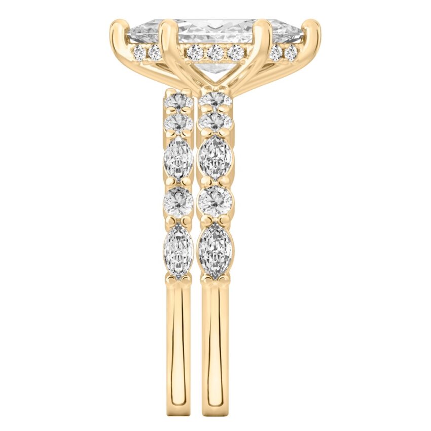Side view of marquise cut diamond hidden halo marquise and round diamond ring set yellow gold