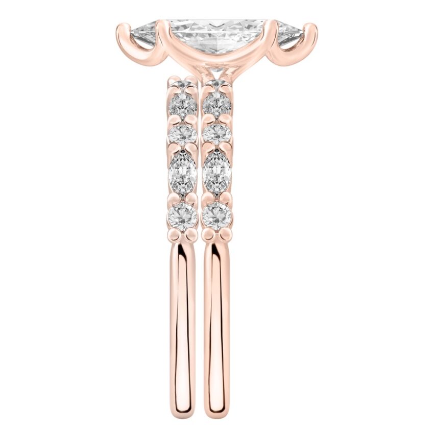 Side view of marquise cut diamond marquise and round diamond ring set rose gold