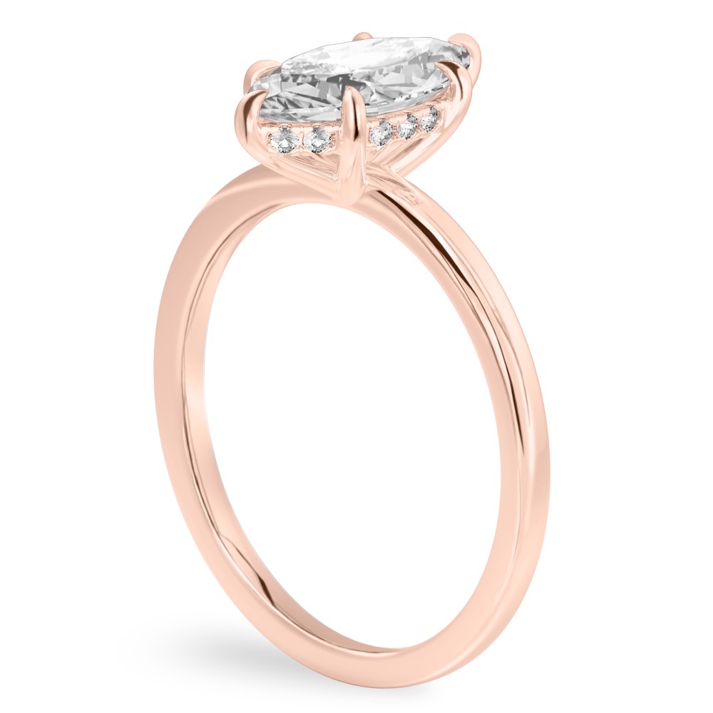 Angle view of marquise cut diamond ultra low hidden halo engagement ring in rose gold