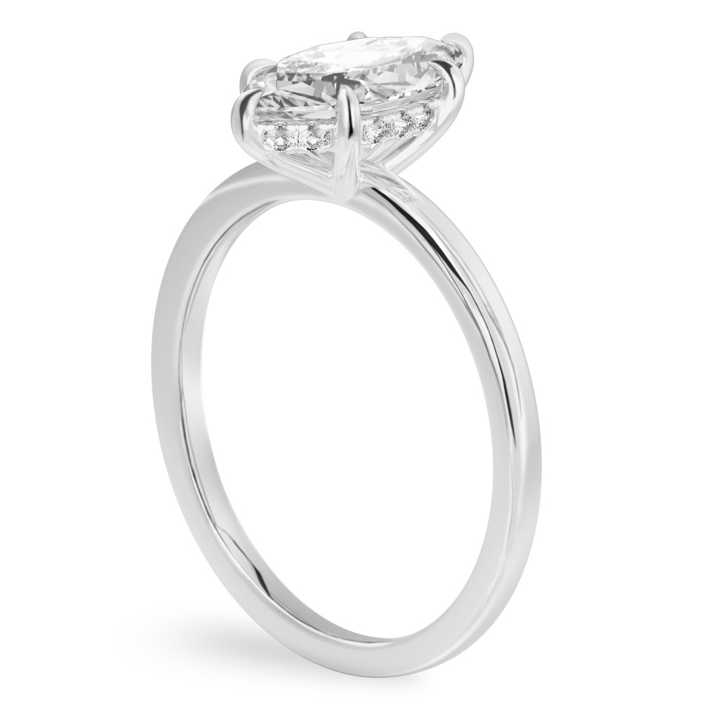 Angle view of marquise cut diamond ultra low hidden halo engagement ring in white gold