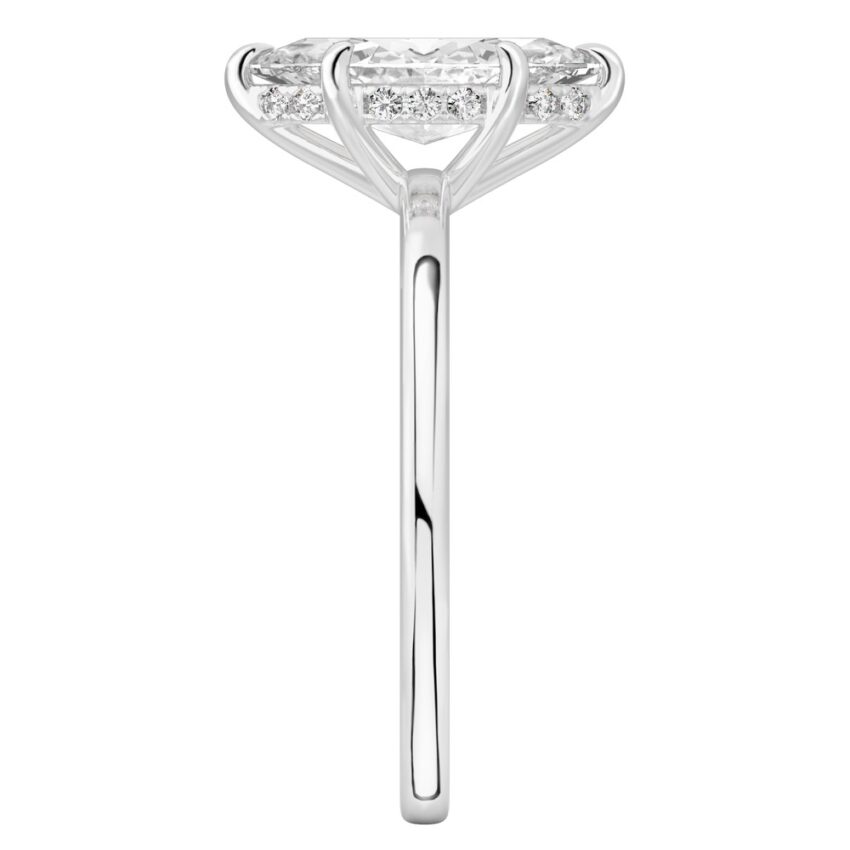 Side view of marquise cut diamond ultra low hidden halo engagement ring in white gold