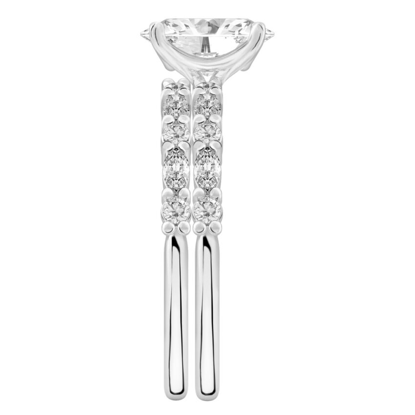 Side view of oval cut diamond marquise and round diamond ring set platinum