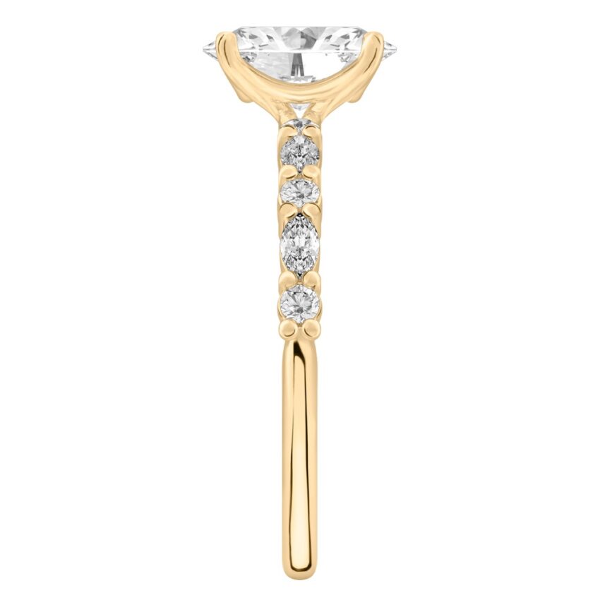 Side view of oval cut diamond marquise and round diamond ring yellow gold