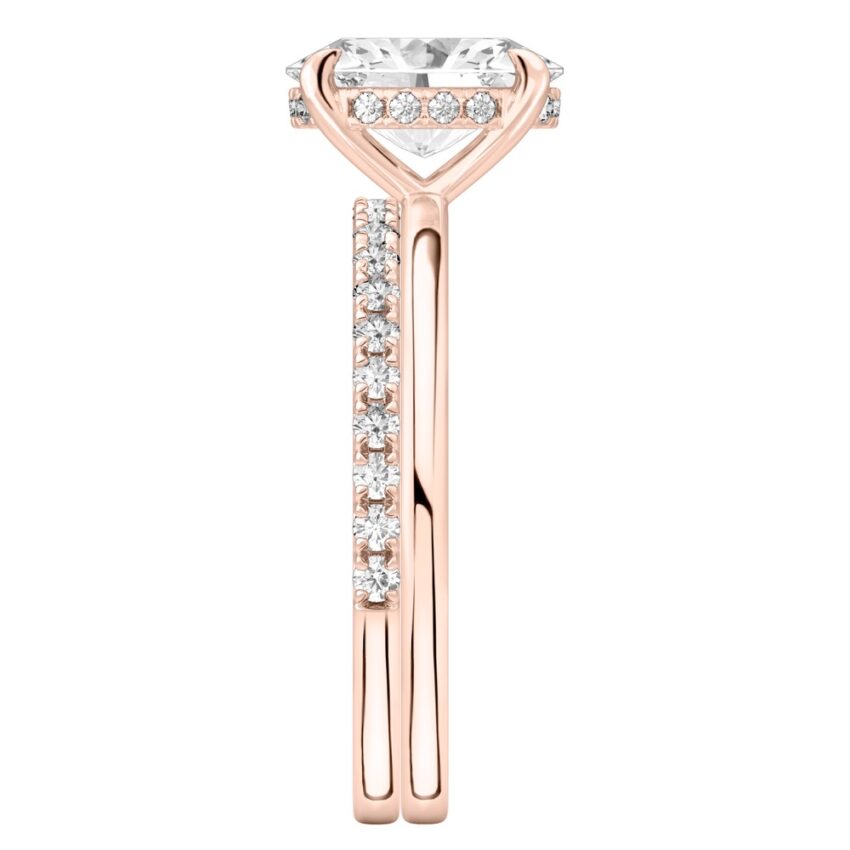 Side view of oval shape diamond hidden halo engagement ring set rose gold
