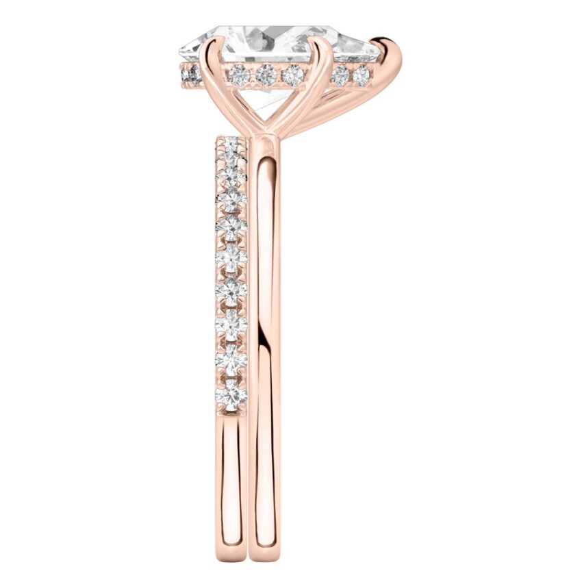Side view of pear shape diamond hidden halo engagement ring set rose gold
