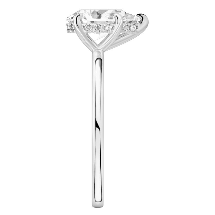Side view of pear shape diamond hidden halo engagement ring in white gold