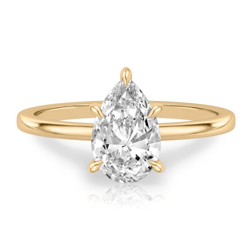 pear shape diamond hidden halo engagement ring in yellow gold