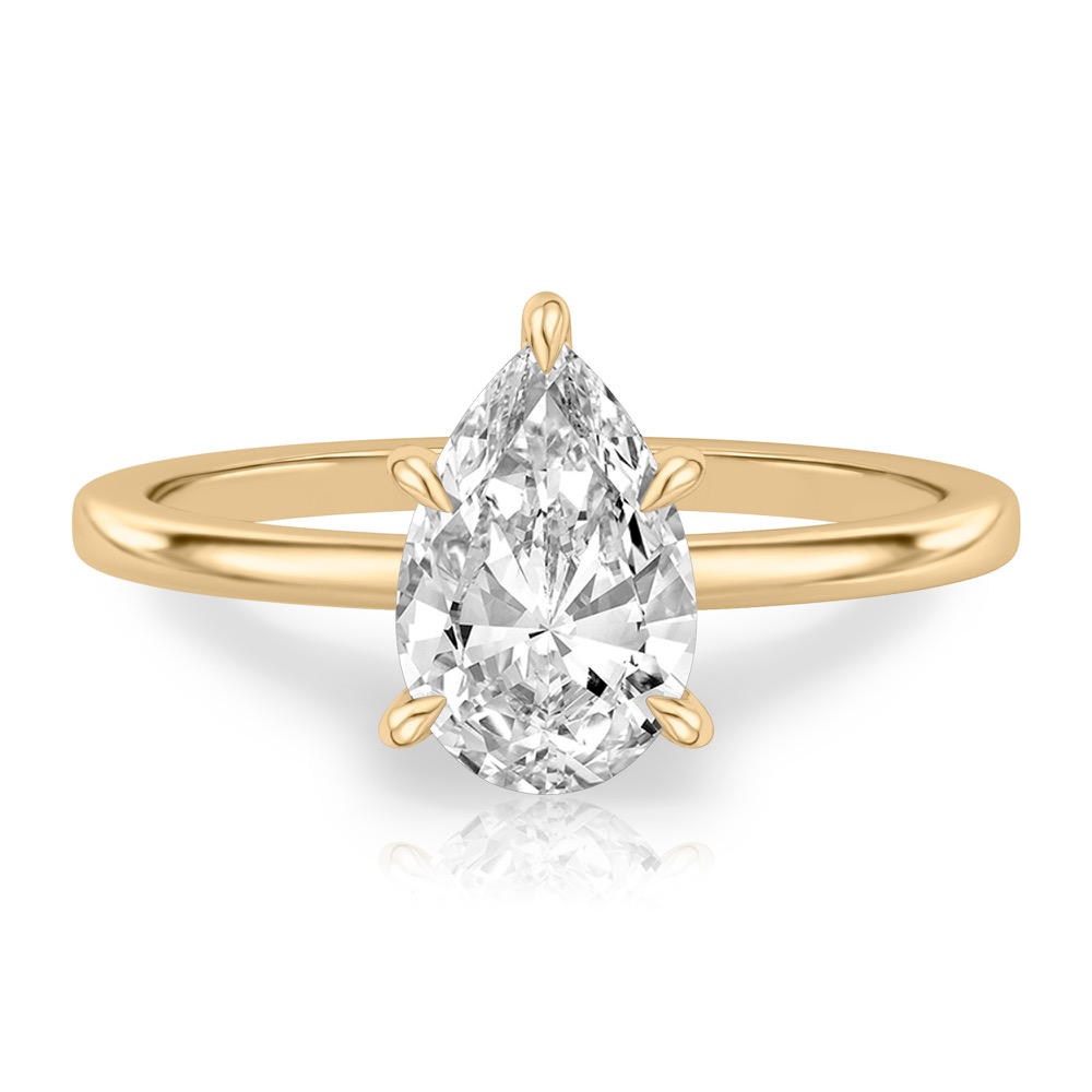 pear shape diamond hidden halo engagement ring in yellow gold