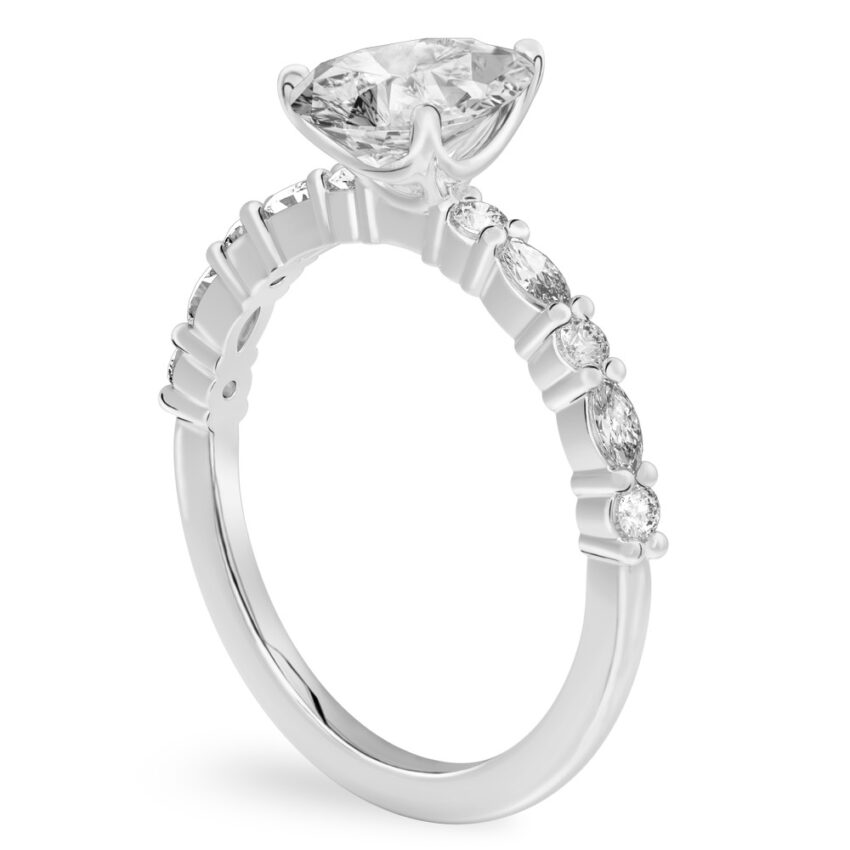 Angle view of pear shape diamond marquise and round diamond ring platinum