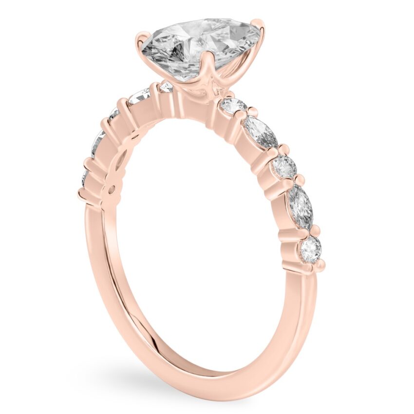 Angle view of pear shape diamond marquise and round diamond ring rose gold