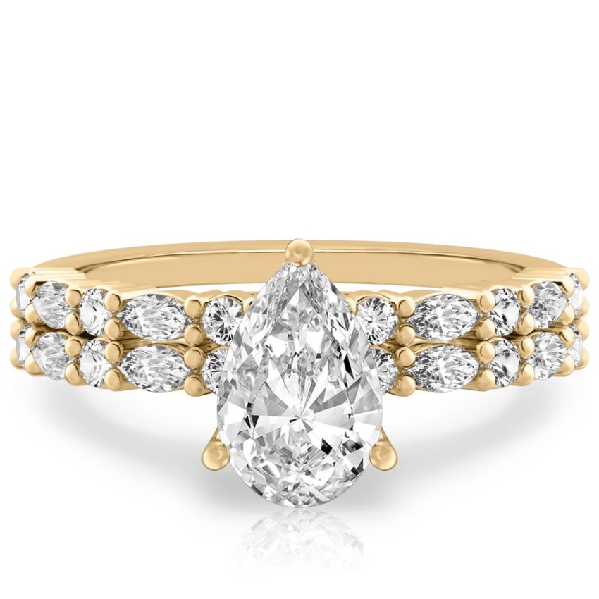 pear shape diamond marquise and round diamond ring set yellow gold