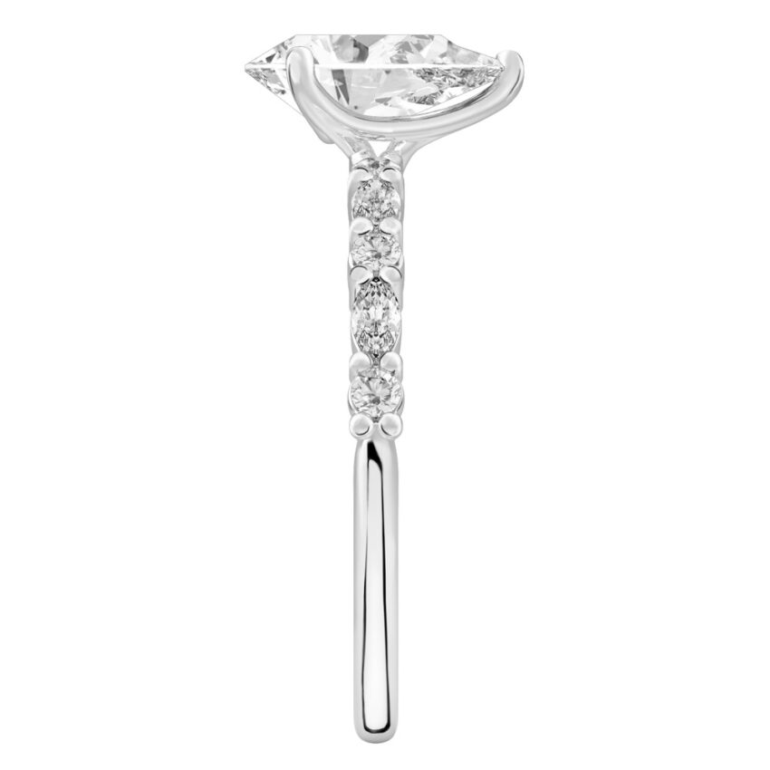 Side view of pear shape diamond marquise and round diamond ring white gold