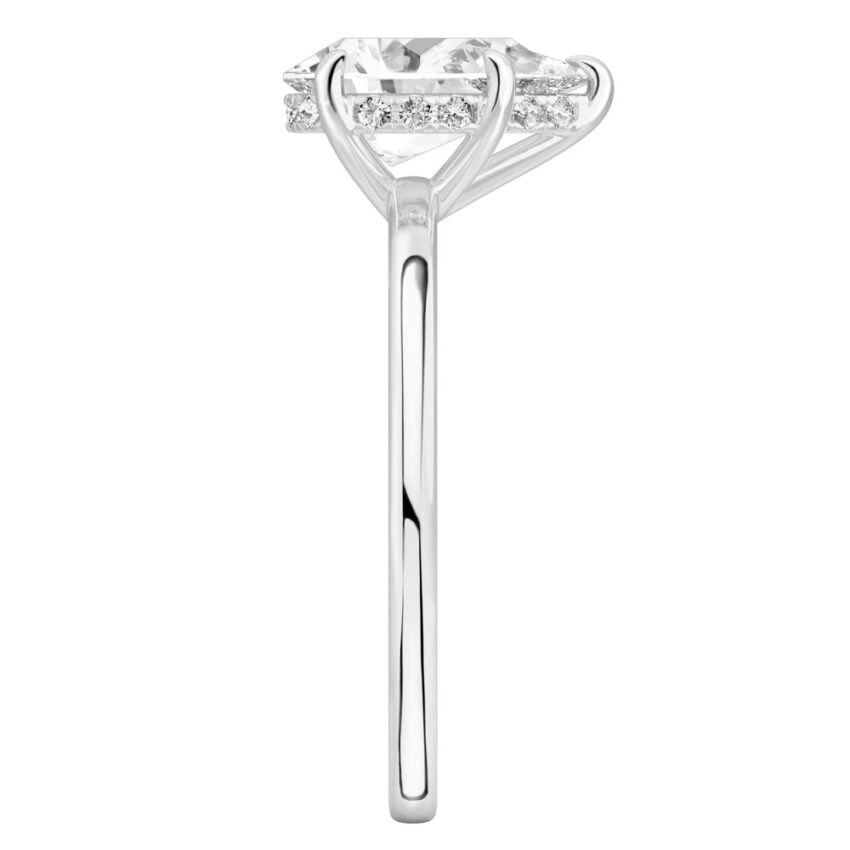 Side view of pear shape diamond ultra low hidden halo engagement ring in palladium