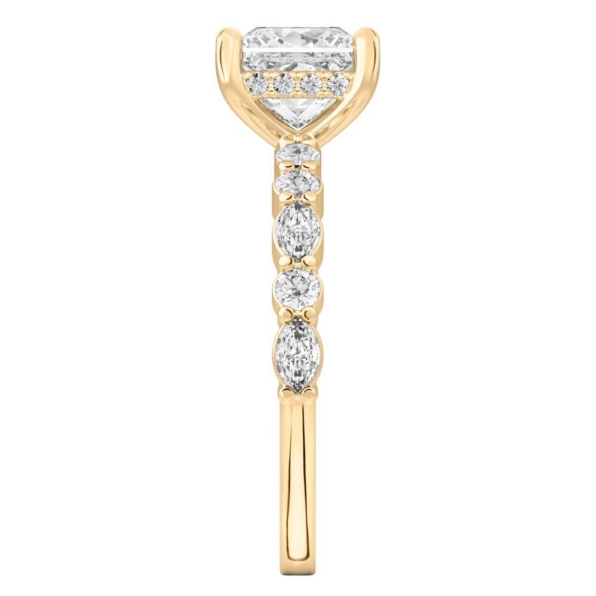 Side view of princess cut diamond hidden halo marquise and round diamond ring yellow gold