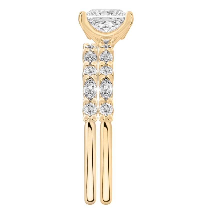 Side view of princess cut diamond marquise and round diamond ring set yellow gold