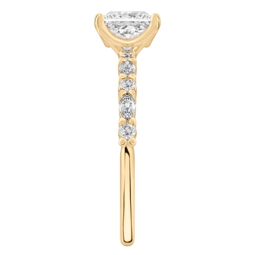 Side view of princess cut diamond marquise and round diamond ring yellow gold