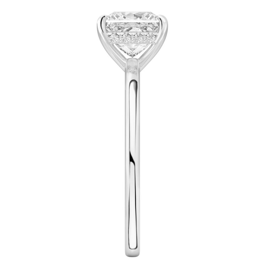 Side view of princess cut diamond ultra low hidden halo engagement ring in platinum