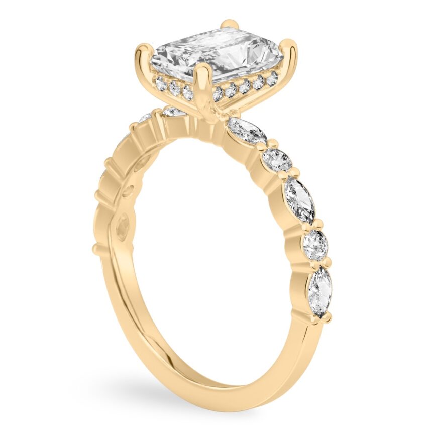 Angle view of radiant cut diamond hidden halo marquise and round diamond ring yellow gold