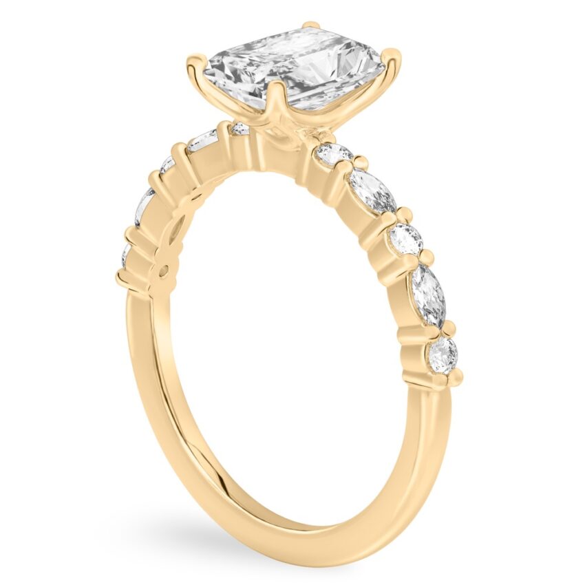 Angle view of radiant cut diamond marquise and round diamond ring yellow gold