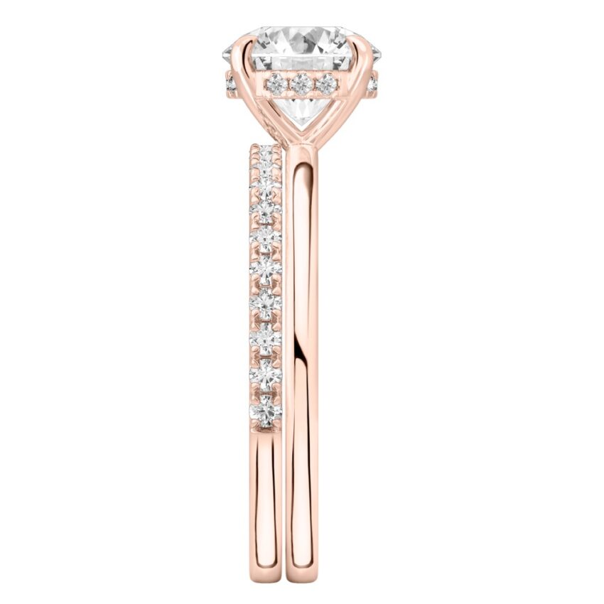 Side view of round cut diamond flush hidden halo engagement ring set rose gold