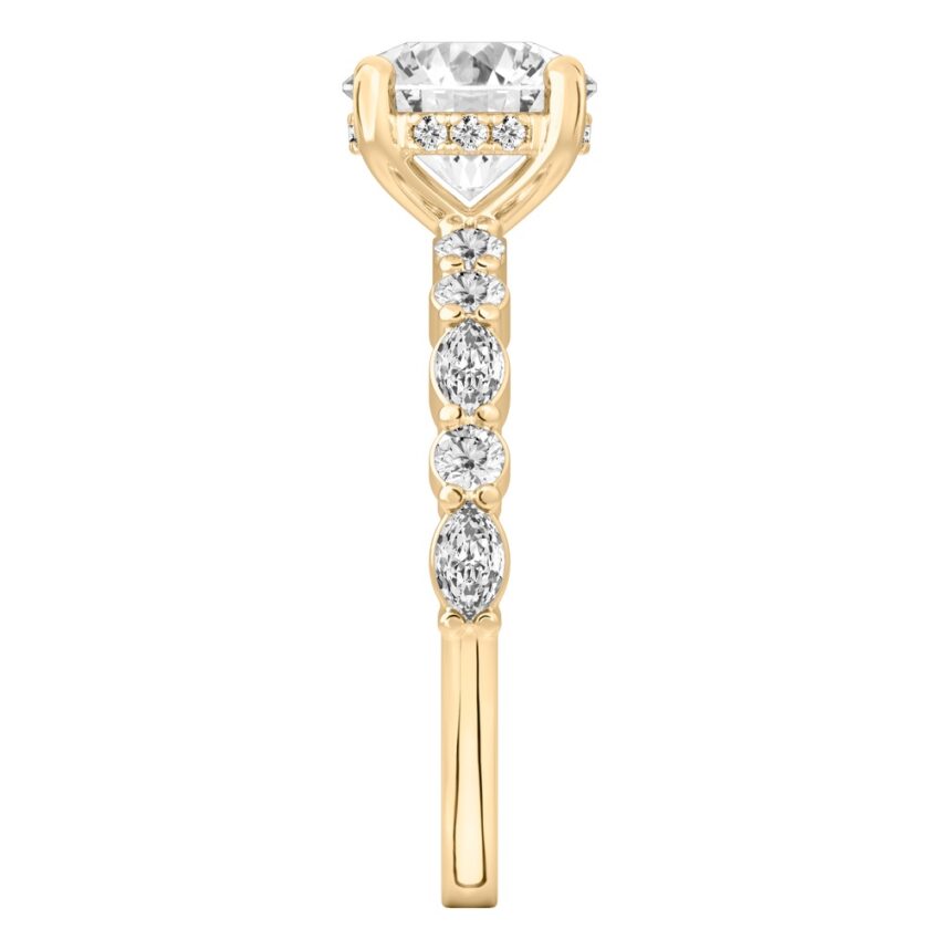 Side view of round cut diamond hidden halo marquise and round diamond ring yellow gold