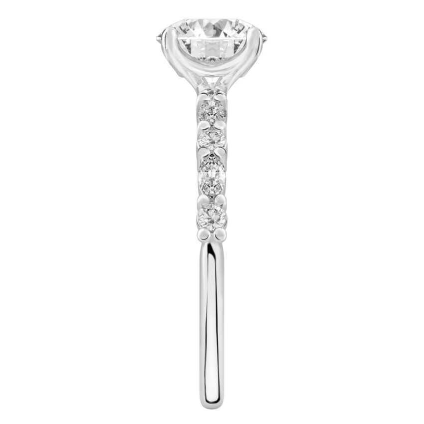 Side view of round cut diamond marquise and round diamond ring platinum