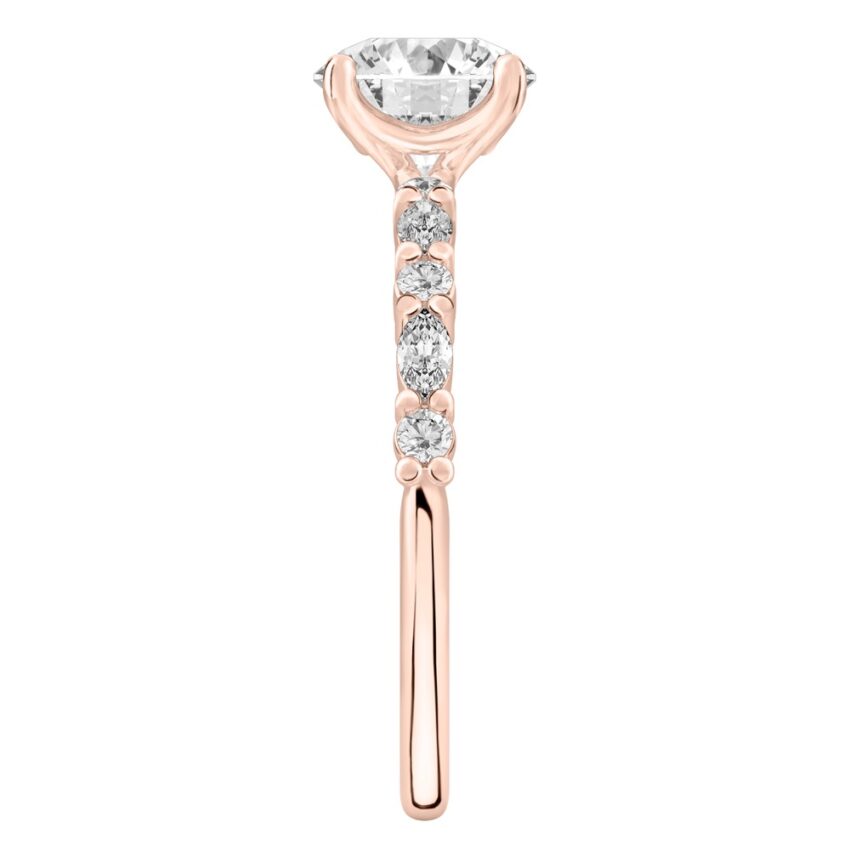 Side view of round cut diamond marquise and round diamond ring rose gold