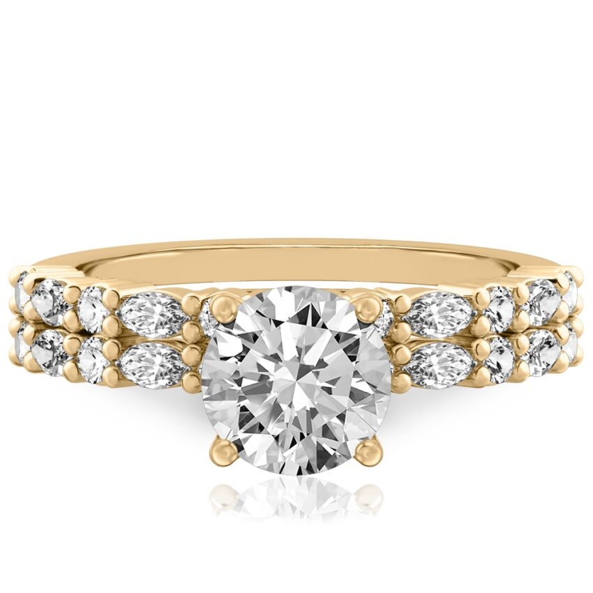 round cut diamond marquise and round diamond ring set yellow gold