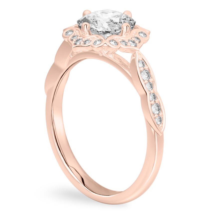 Angle view of cushion cut diamond floral engagement ring in rose gold