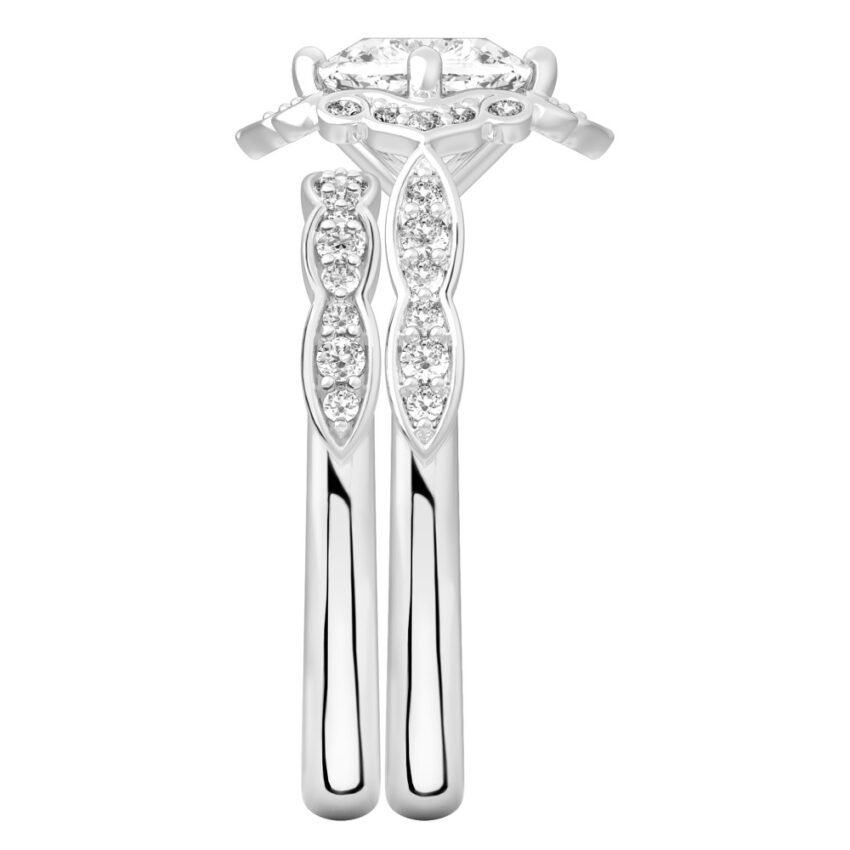 Side view of cushion cut diamond floral engagement ring set white gold