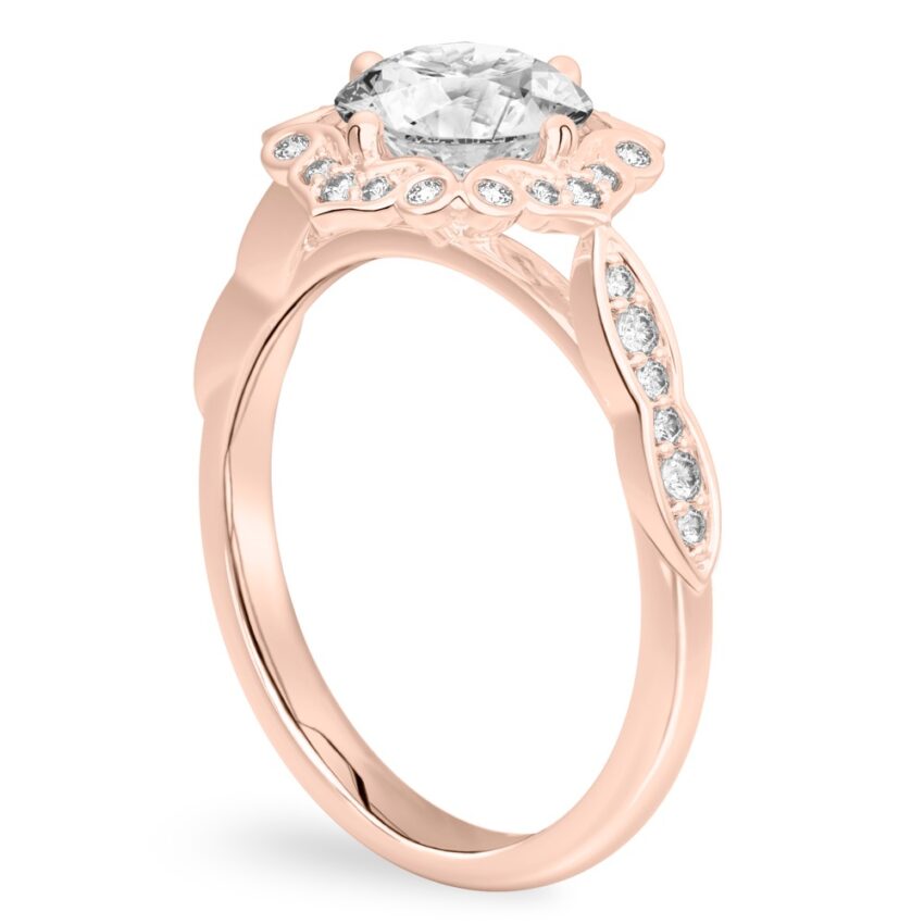 Angle view of round cut diamond floral engagement ring in rose gold