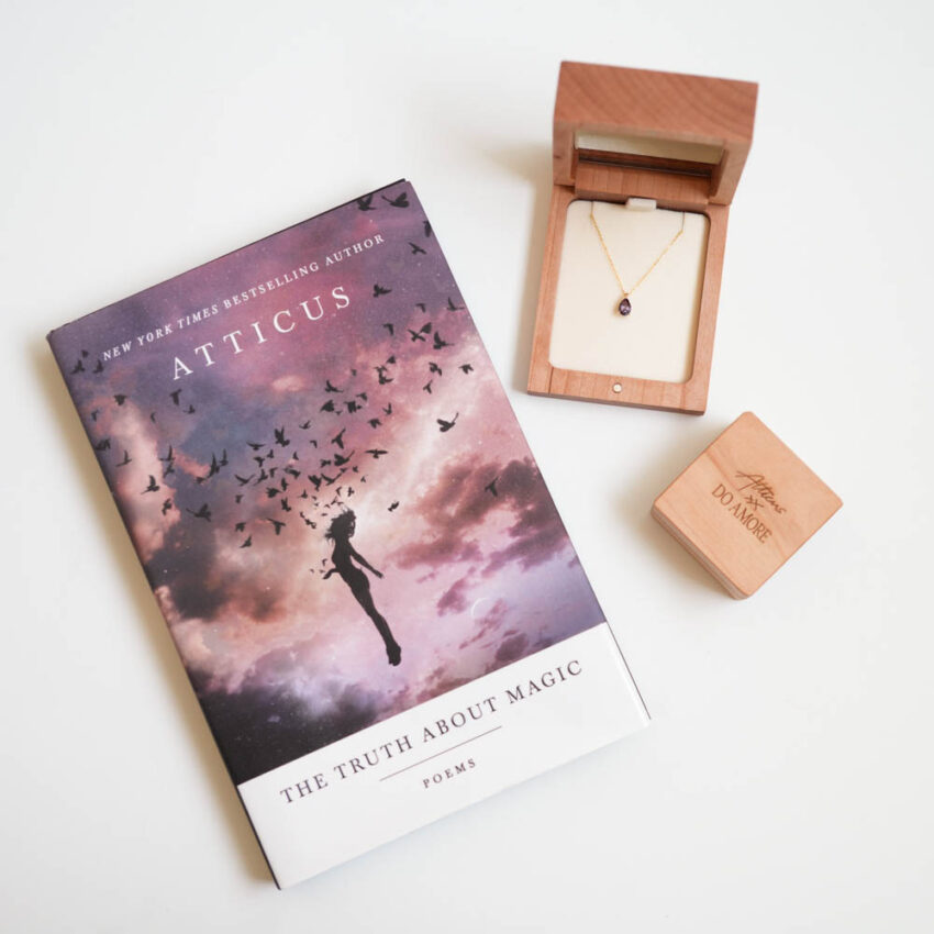 alexandrite necklace in and earrings with book and packaging lifestyle