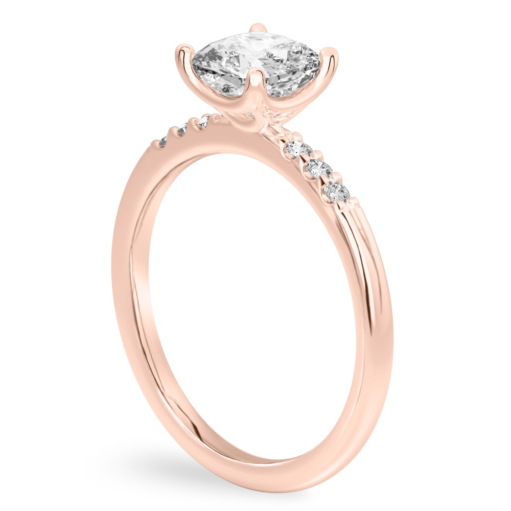 Angle view of cushion cut diamond minimalist pave engagement ring in rose gold