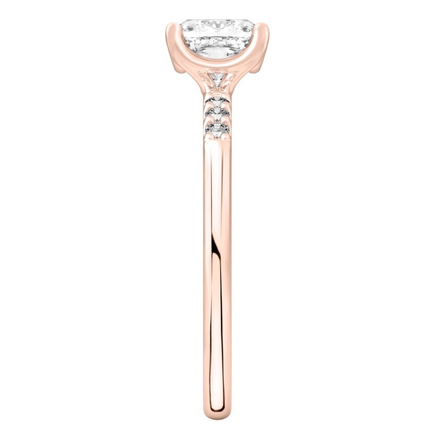 Side view of cushion cut diamond minimalist pave engagement ring in rose gold
