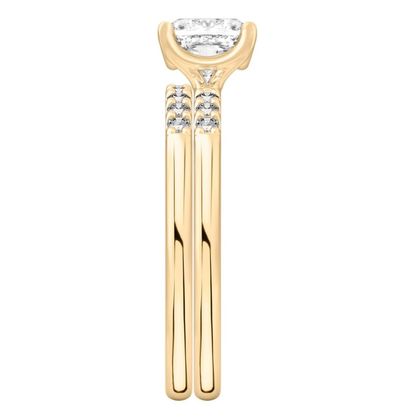 Side view of cushion cut diamond minimalist pave engagement ring set yellow gold