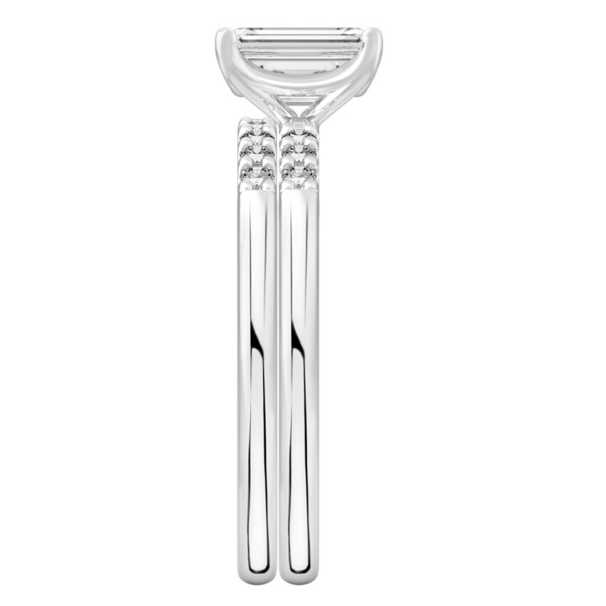 Side view of emerald cut diamond minimalist pave engagement ring set platinum