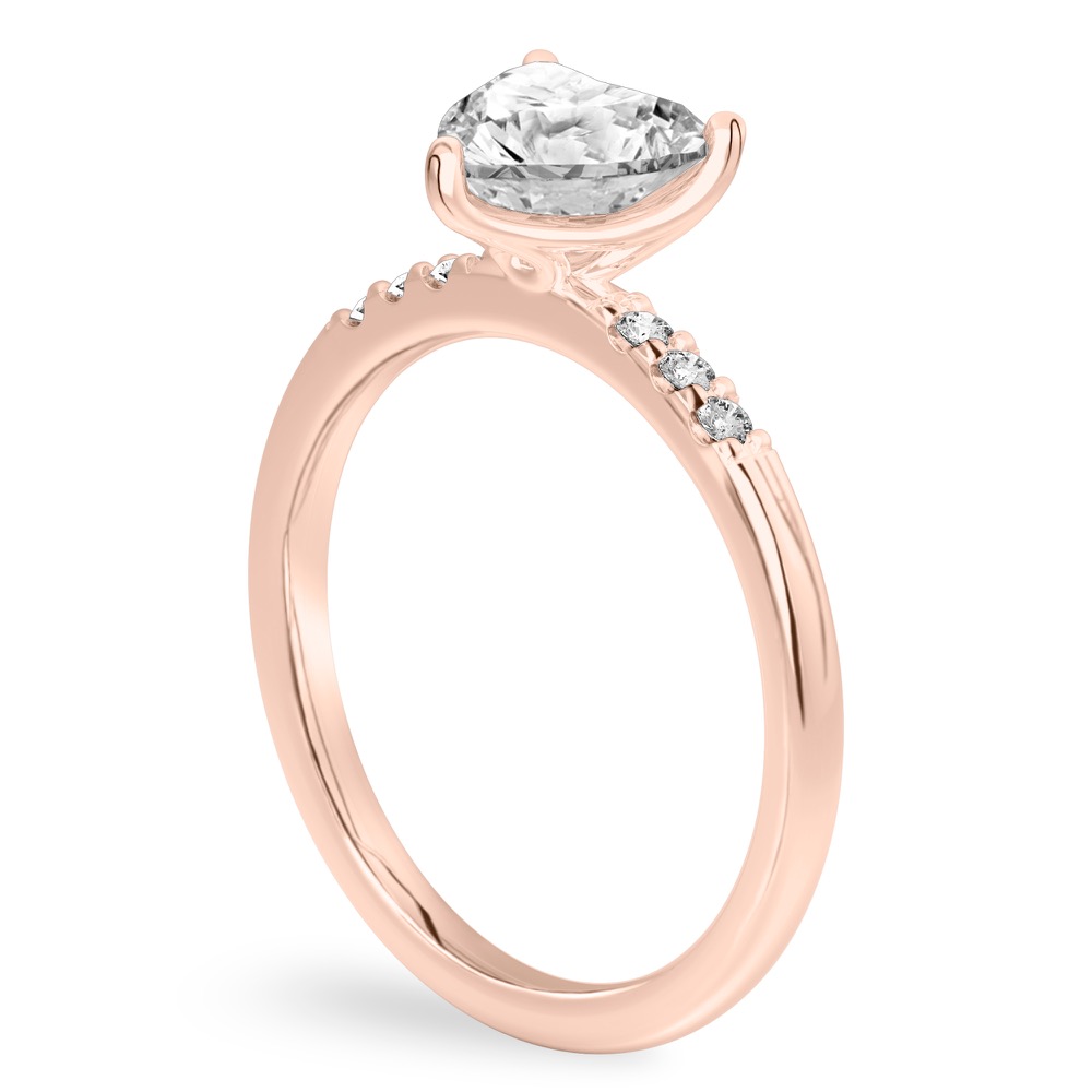 Angle view of heart shape diamond minimalist pave engagement ring in rose gold