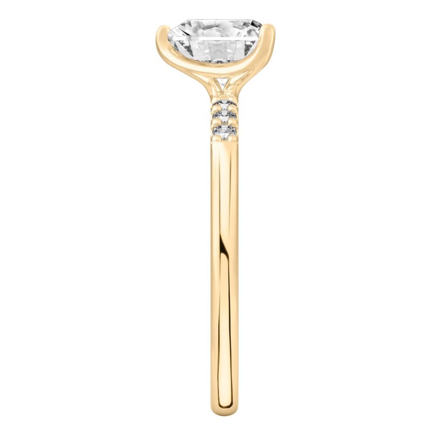 Side view of heart shape diamond minimalist pave engagement ring in yellow gold