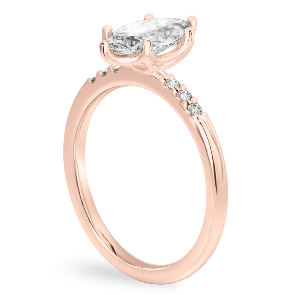 Angle view of marquise cut diamond minimalist pave engagement ring in rose gold