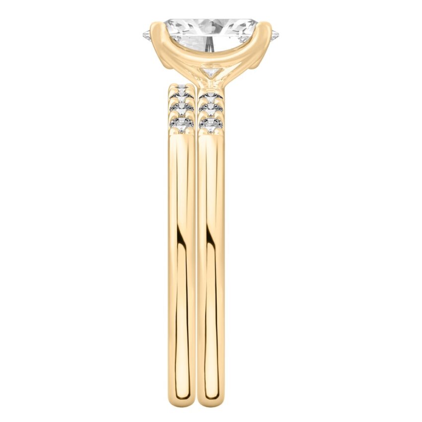 Side view of oval cut diamond minimalist pave engagement ring set yellow gold