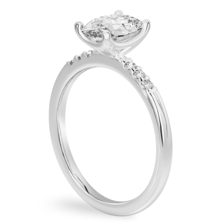 Angle view of oval cut diamond minimalist pave engagement ring in white gold