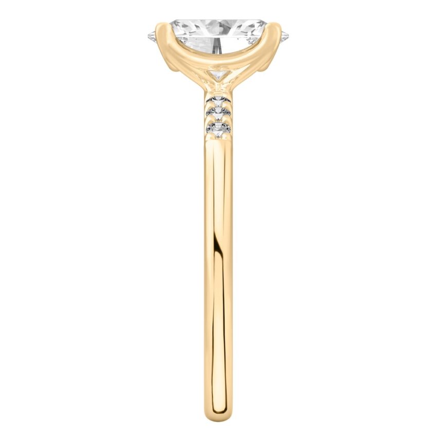 Side view of oval cut diamond minimalist pave engagement ring in yellow gold