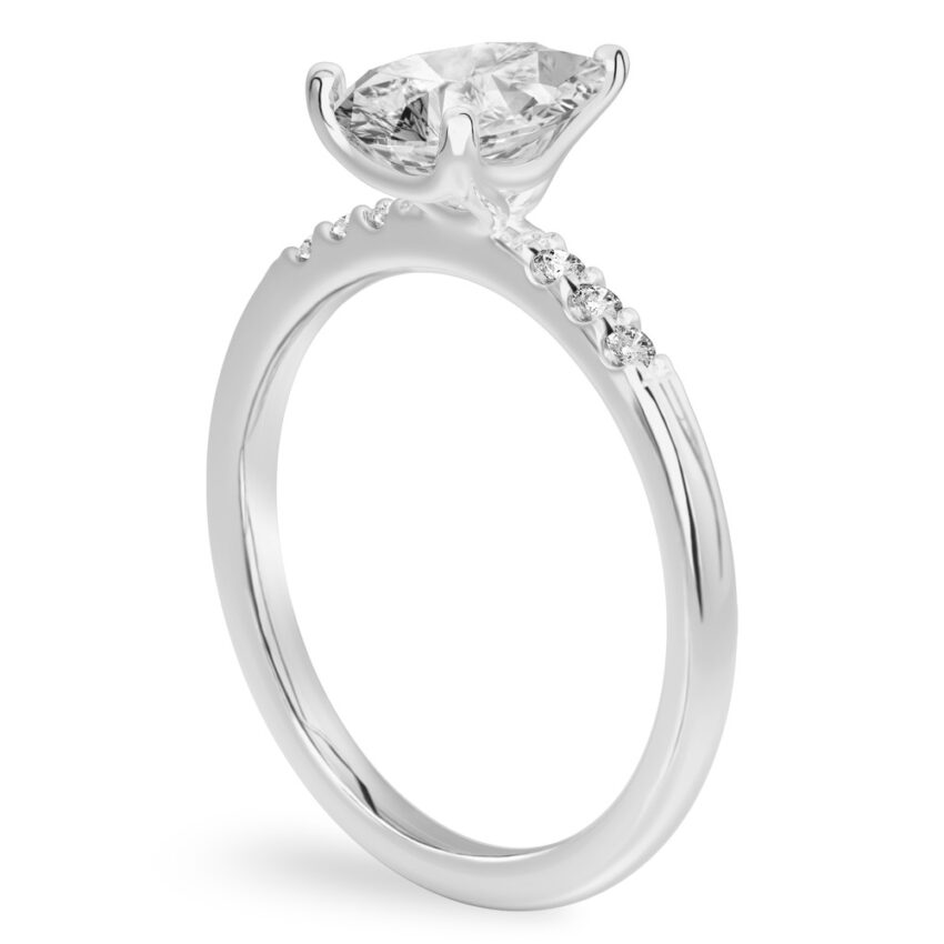 Angle view of pear shape diamond minimalist pave engagement ring in platinum
